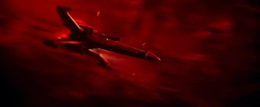 Rey pilote le X-Wing de Luke à travers une zone instable des Régions Inconnues en direction d’Exegol.
